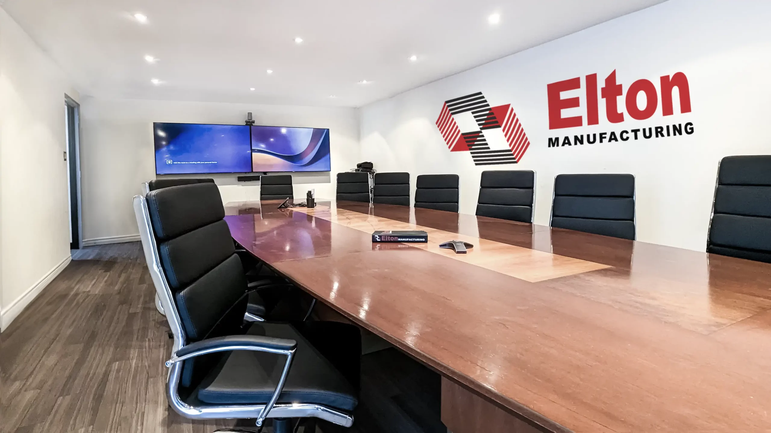 meeting room w logo Elton Manufacturing Meeting room at main office in Aerowood dr Mississauga